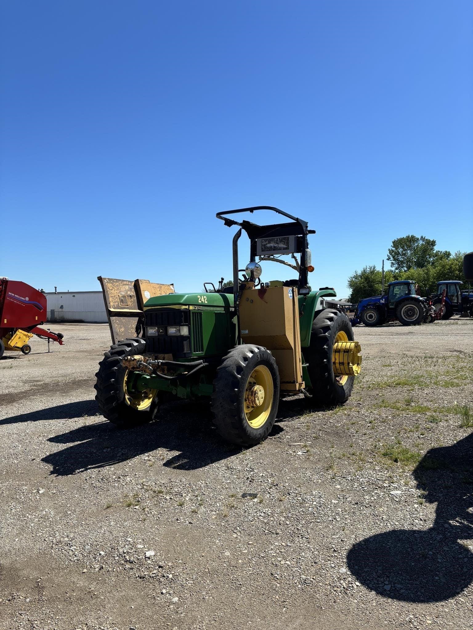 1999 John Deere 6310 Equipment Image0