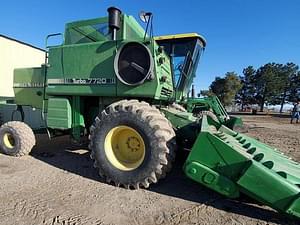 John Deere 7720 Combine w/ Grain Header Image