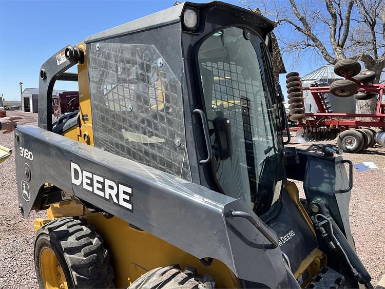 Main image John Deere 318D 12
